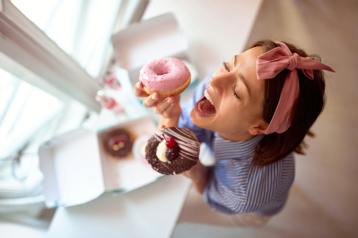 Small business owner is passionate about her appetizing product/ donuts